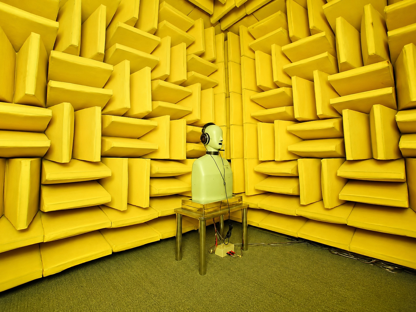 Acoustic testing chamber used as audio manufacturing capability context